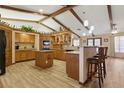 Spacious kitchen featuring an island, wooden cabinets, and stainless steel appliances at 22349 Columbus Ave, Port Charlotte, FL 33954