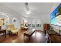 Inviting living room with hardwood floors, neutral walls, and ample natural light at 22353 Blanchard Ave, Port Charlotte, FL 33952
