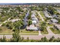 Picturesque aerial view of a home nestled among a network of canals and waterways in a residential neighborhood at 3129 Buttonwood Pl, Punta Gorda, FL 33950