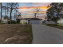 Charming single-story home with a well-manicured lawn, complemented by a spacious driveway and an attached two-car garage at 3799 Laredo Ave, North Port, FL 34288