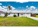 Inviting single story home with a well-maintained lawn and curb appeal at 416 Allen St, Punta Gorda, FL 33950