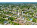 A home nestled in a sprawling neighborhood with lush greenery at 7183 Spinnaker Blvd, Englewood, FL 34224