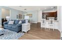 Bright and airy living room with stylish furniture, hardwood floors, and modern lighting at 8866 Tuscany Isles Dr, Punta Gorda, FL 33950