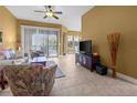 Inviting living room features comfortable seating, neutral decor, and sliding glass doors to outdoor living area at 99 Vivante Blvd # 310, Punta Gorda, FL 33950