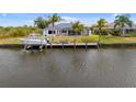 Picturesque waterfront property with private dock, perfect for boating and enjoying scenic water views at 15890 Viscount Cir, Port Charlotte, FL 33981