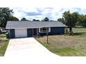 Charming single-story home with a well-maintained lawn, paved driveway, and attached garage at 2028 River Basin Ter, Punta Gorda, FL 33982