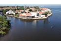 Waterfront home with a red tile roof features an enclosed porch, back patio and beautiful views of the waterway at 25188 Marion Ave # 1, Punta Gorda, FL 33950
