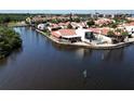 Waterfront home with a red tile roof features an enclosed porch, back patio and beautiful views of the waterway at 25188 Marion Ave # 1, Punta Gorda, FL 33950