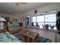 Cozy living room with waterfront views, comfortable seating, and tropical decor at 3772 Peace River Dr, Punta Gorda, FL 33983