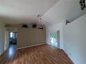 A bright living room with sliding doors to the outside, and a ceiling fan at 4205 Simkins Ave, North Port, FL 34286