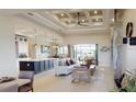 Bright living space featuring a modern design, fireplace, and seamless access to outdoor living at 4426 Vasco St, Punta Gorda, FL 33950