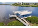 An upgraded boat dock and lift are ready for waterfront living and recreation at 5061 Collingswood Blvd, Port Charlotte, FL 33948