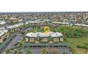Aerial view of condo with parking and nearby canal residences in a well-maintained, desirable neighborhood at 601 Shreve St # 64C, Punta Gorda, FL 33950