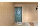 Inviting front door with decorative doormat creating a warm welcome to visitors and residents at 601 Shreve St # 64C, Punta Gorda, FL 33950