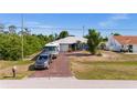 Charming single-story home with a paved driveway and ample parking for several vehicles at 10229 Gulfstream Blvd, Englewood, FL 34224