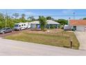 Well-maintained home with lush landscaping and ample parking at 10229 Gulfstream Blvd, Englewood, FL 34224