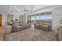 Bright and airy living room featuring balcony access and elegant decor overlooking the beautiful water at 1425 Park Beach Cir # 1310, Punta Gorda, FL 33950