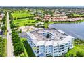 Aerial view of the condo building overlooking the golf course, with water views at 2001 Bal Harbor Blvd # 2306, Punta Gorda, FL 33950