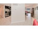 Open floor plan with kitchen, dining area, and living room with water views at 2001 Bal Harbor Blvd # 2306, Punta Gorda, FL 33950