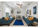 Open-concept living room boasting tile floors, contemporary furniture, and bright decor at 2515 Sherman Oak Dr, North Port, FL 34289