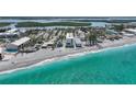 Breathtaking aerial view of the beachfront condo, highlighting its proximity to the ocean and the surrounding coastline at 2590 N Beach Rd # 5, Englewood, FL 34223