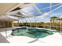The pool features turquoise tile trim and a screen enclosure at 3506 Saint Florent Ct, Punta Gorda, FL 33950