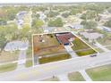Overhead view of a cozy home on a fenced lot surrounded by lush landscaping at 1041 S Salford Blvd, North Port, FL 34287