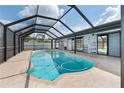 Relaxing screened-in pool area with lounge chairs and plenty of natural light at 1041 S Salford Blvd, North Port, FL 34287