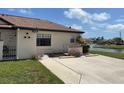 Well-kept condo with a manicured lawn and beautiful landscaping near the water fountain at 13100 S Mccall Rd # 125, Port Charlotte, FL 33981