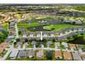 Community aerial view with golf course and ponds showcasing the desirable neighborhood and surrounding landscape at 1812 Birmingham Blvd, Punta Gorda, FL 33980