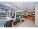 Open-concept living space seamlessly connecting indoor and outdoor areas, showcasing the pool at 2387 Nuremberg Blvd, Punta Gorda, FL 33983