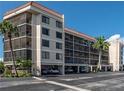 Beautiful four-story condo building featuring screened balconies and covered parking in desirable location at 25188 Marion Ave # F202, Punta Gorda, FL 33950