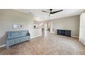 Spacious living room with tile floors, neutral walls, and access to kitchen and dining areas at 3171 Highlands Rd, Punta Gorda, FL 33983