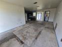 Open floor plan shows living room and kitchen with open layout and a sliding glass door at 4424 Baroda Ave, North Port, FL 34287