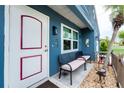 Inviting front entrance featuring bench seating and charming decor at 4583 S Salford Blvd, North Port, FL 34287