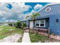 Welcoming entrance with a white door, bench seating, and decorative elements at 4583 S Salford Blvd, North Port, FL 34287