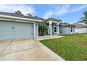 Beautiful single-story home featuring a well-manicured lawn and a welcoming front entrance at 5436 Jessamine Ave, North Port, FL 34291