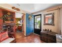 Inviting foyer with colorful blue doors and tiled flooring at 611 Bonita Ct, Punta Gorda, FL 33950