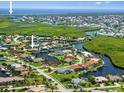 Stunning aerial view of waterfront homes in a beautiful coastal community at 632 Brindisi Ct, Punta Gorda, FL 33950