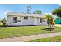 Well-maintained single-Gathering home with a beautiful lawn and mature landscaping at 6764 Stardust Ave, North Port, FL 34287