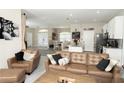 Open-concept living area flows into dining and kitchen with a cozy, inviting atmosphere at 6794 Loffreda Ave, North Port, FL 34291