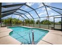 Inviting screened-in pool with clear blue water, perfect for relaxation and entertainment at 1472 Oriel Ct, Punta Gorda, FL 33983