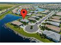 Aerial view of a well landscaped neighborhood with ponds at 15974 Clear Skies Pl, Bradenton, FL 34211