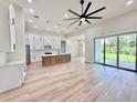 Bright and airy living space with high ceilings and ample natural light from large sliding doors at 2089 Garnet St, North Port, FL 34288