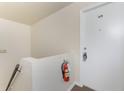 Bright hallway features a fire extinguisher and entry door number 48, ensuring safety and accessibility at 22481 Westchester Blvd # B48, Punta Gorda, FL 33980