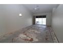 Open living area with a sliding glass door to the outside, awaiting your personal touch and design ideas at 3803 Albacete Cir # 64, Punta Gorda, FL 33950