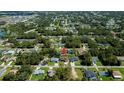 Aerial view of a residential neighborhood with tree-lined streets and well-maintained homes at 4294 Wooley Ave, North Port, FL 34287