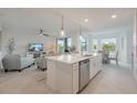 Bright, open kitchen featuring a center island, stainless steel appliances, and seamless flow to living spaces at 14141 Heritage Landing Blvd # 912, Punta Gorda, FL 33955
