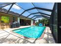 Inviting screened pool area perfect for outdoor entertaining and relaxation at 17150 Sarong Ln, Punta Gorda, FL 33955