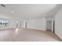 Spacious and naturally bright living room area with new flooring at 2138 Blaser St, Punta Gorda, FL 33980